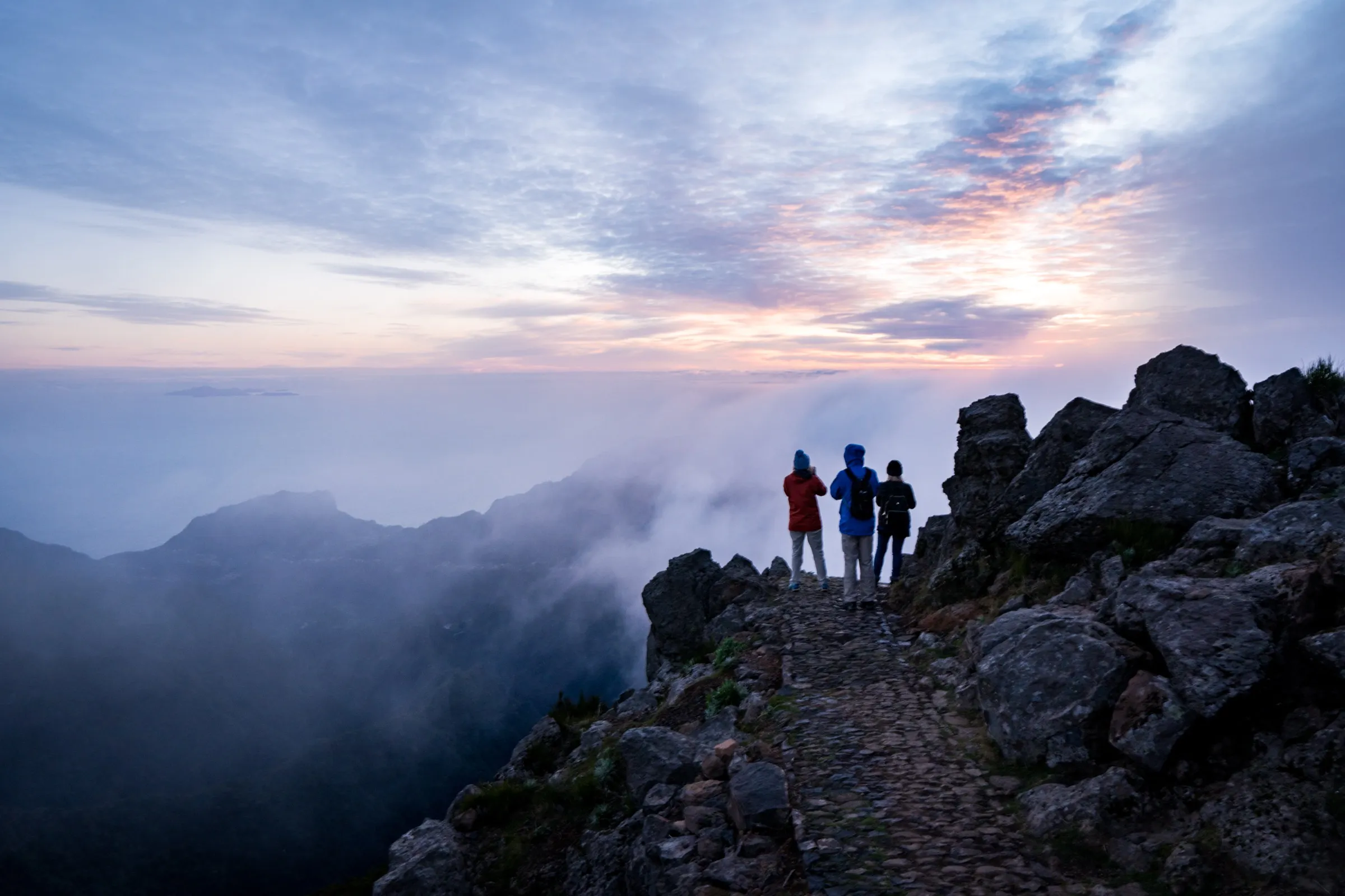 Silhouettes at the peak, dawn