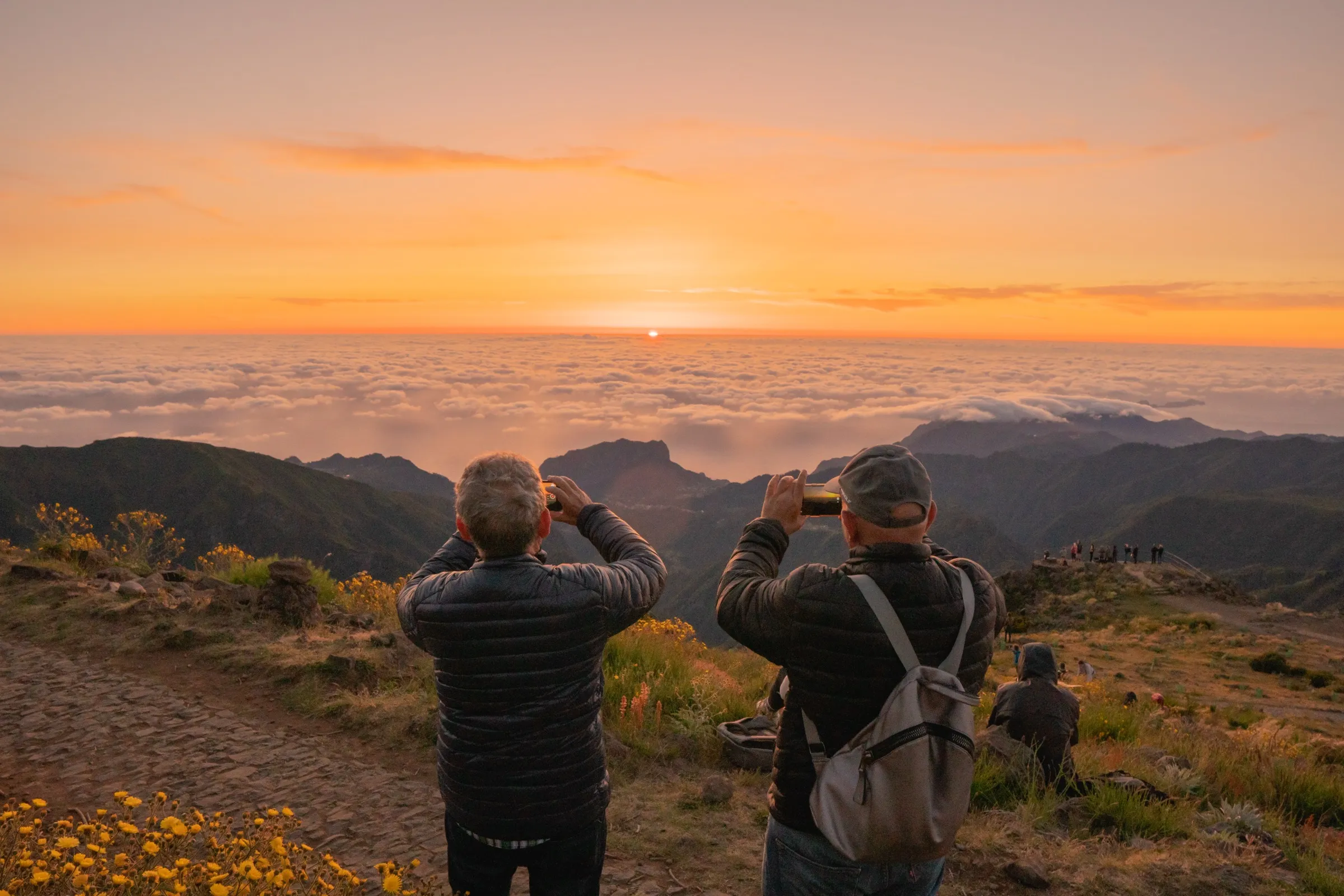 Golden hour, silhouettes at the peak