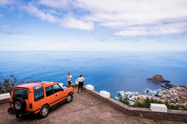 Couple + guide, coastal viewpoint